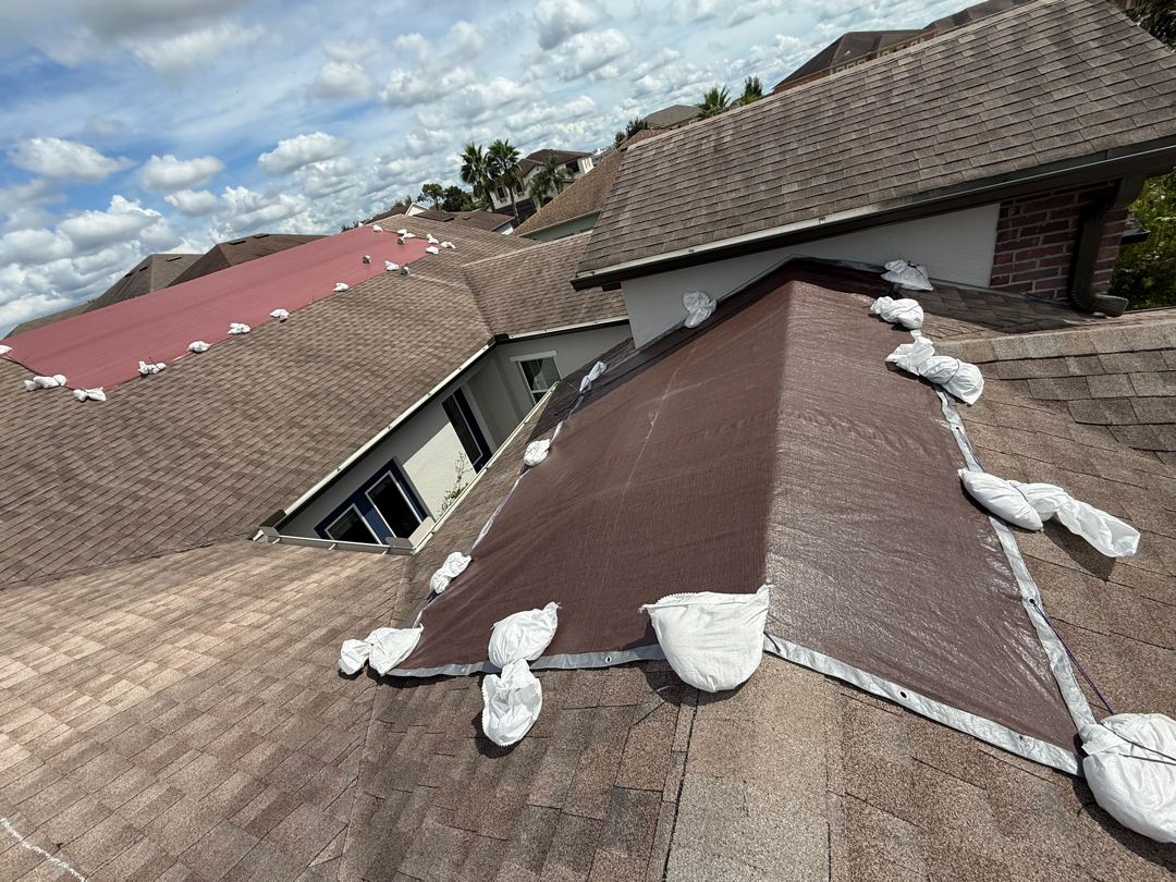 Additional view of completed sandbag tarp install on Florida roof