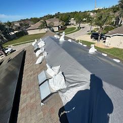 Close-up of patent-pending non-invasive sandbag and framing tarp system